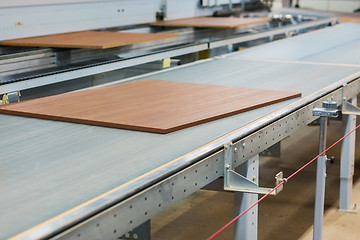 Image showing wooden boards on conveyer at furniture factory