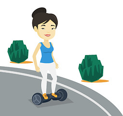 Image showing Woman riding on self-balancing electric scooter.