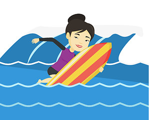 Image showing Happy surfer in action on a surf board.