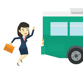 Image showing Latecomer woman running for the bus.