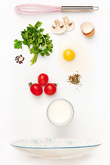 Image showing The falling ingredients of fried egg. Healthy breakfast ingredients.