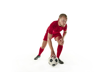 Image showing Professional football soccer player with ball isolated white background