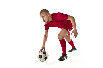 Image showing Professional football soccer player with ball isolated white background