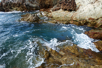 Image showing Waves on stone beach