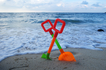 Image showing Toys on the beach sand 