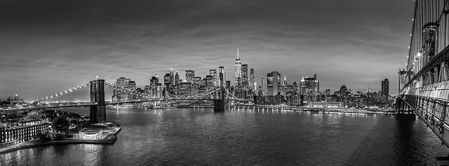 Image showing Brooklyn Bridge and Lower Manhattan skyline at night, New York city, USA.