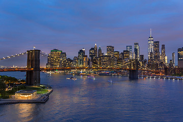 Image showing Brooklyn Bridge and Lower Manhattan skyline at night, New York city, USA.