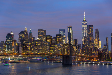 Image showing Brooklyn Bridge and Lower Manhattan skyline at night, New York city, USA.