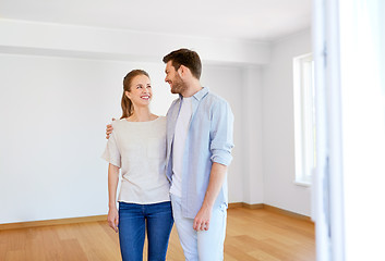 Image showing happy couple hugging at new home