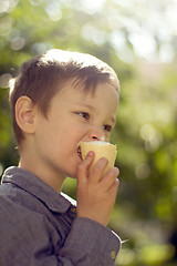 Image showing Boy eating ice cream