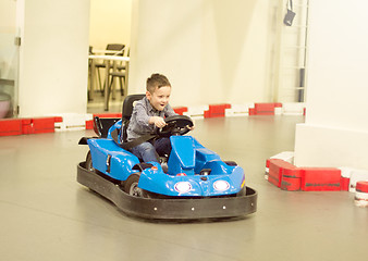 Image showing Boy in bumper car driving autoscooter