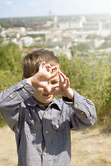 Image showing Boy pretending that he is a cameraman