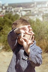 Image showing Boy pretending that he is a cameraman