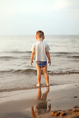 Image showing Happy boy playing on the beach