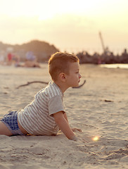 Image showing Happy boy playing on the beach