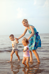 Image showing Happy family playing on the beach