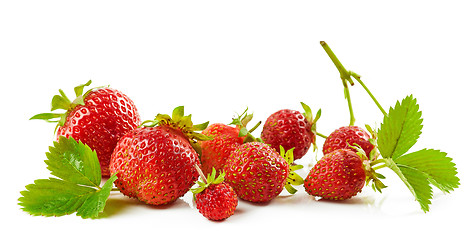 Image showing fresh red strawberries with green leaves