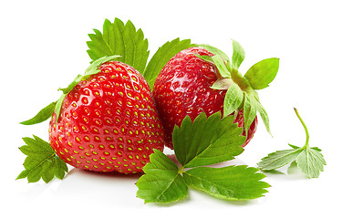 Image showing fresh red strawberries with green leaves