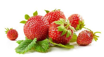 Image showing fresh red strawberries with green leaves