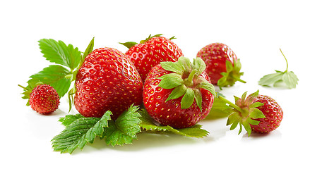 Image showing fresh red strawberries with green leaves