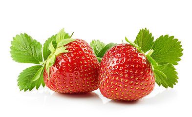 Image showing fresh red strawberries with green leaves