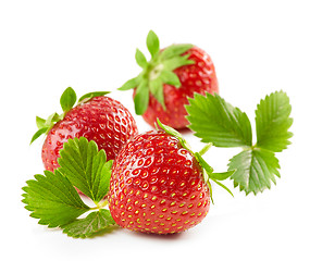 Image showing fresh red strawberries with green leaves