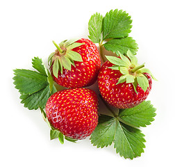 Image showing fresh red strawberries with green leaves