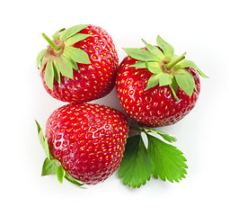 Image showing fresh red strawberries with green leaves