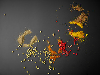 Image showing various spices on black background
