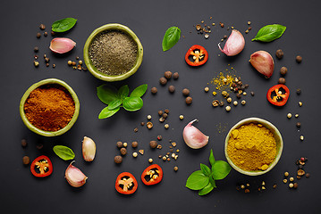 Image showing various spices on black background