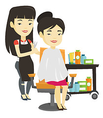 Image showing Hairdresser making haircut to young woman.