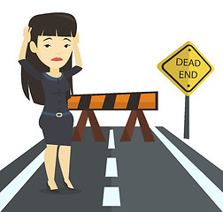Image showing Business woman looking at road sign dead end.