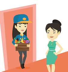 Image showing Delivery courier delivering groceries to customer.