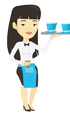 Image showing Waitress holding tray with cups of coffeee or tea.