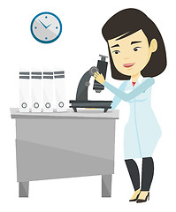 Image showing Laboratory assistant with microscope.