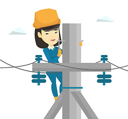 Image showing Electrician working on electric power pole.