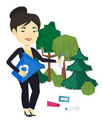 Image showing Woman collecting garbage in forest.