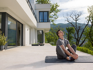 Image showing man doing morning yoga exercises