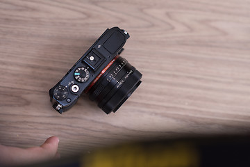 Image showing camera on a wooden table