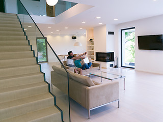 Image showing young happy couple relaxes in the living room