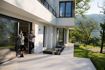 Image showing couple enjoying on the door of their luxury home villa