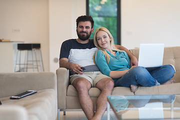 Image showing young happy couple relaxes in the living room