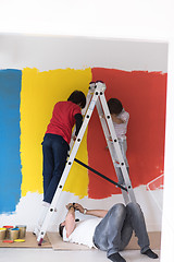 Image showing boys painting wall