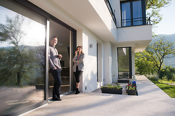 Image showing couple enjoying on the door of their luxury home villa