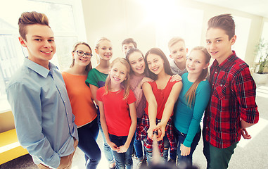 Image showing group of students taking selfie with smartphone