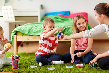 Image showing kids and mother with modelling clay or slimes