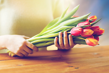 Image showing close up of woman holding tulip flowers