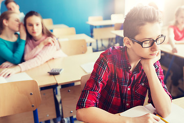 Image showing students gossiping behind classmate back at school