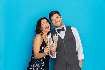 Image showing happy couple with champagne glasses at party