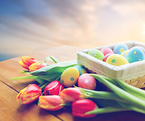 Image showing close up of easter eggs and flowers on table